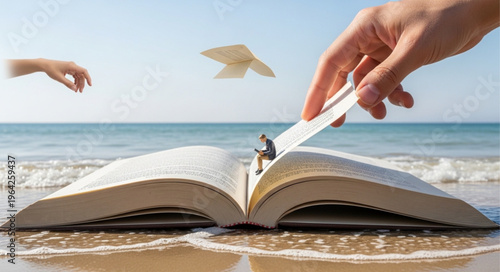 Man on book at beach.