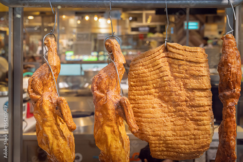 Tableau sur toile Traditional Thai Restaurant Display with Roasted Ducks and Crispy Pork Belly – A