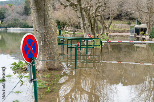 Flooded lake, trees and road signs. High quality photo