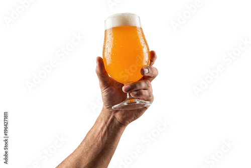 raised male arm holding up a frosty stemmed glass of hazy golden craft beer isolated on a transparent background
