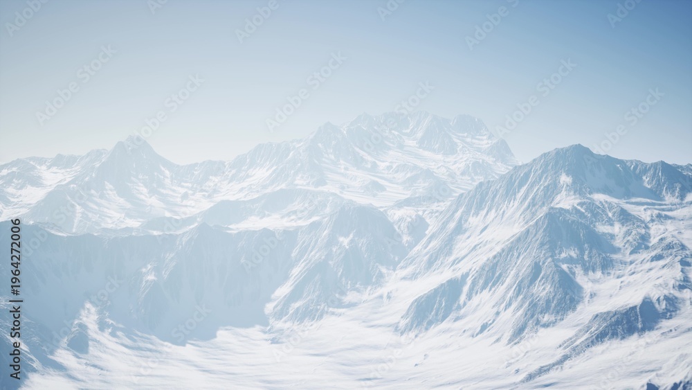 Obraz premium Towering peaks blanketed in fresh snow stretch across the horizon, reflecting the bright sunlight. The tranquil landscape offers a sense of peace and beckons exploration in winters embrace.