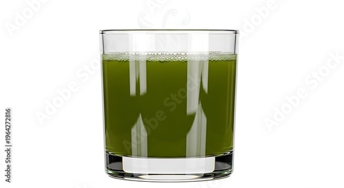 Glass of green juice on table.