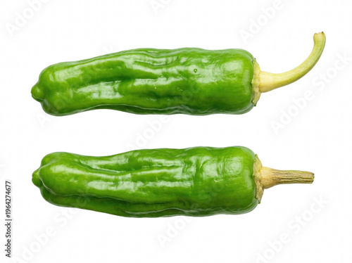 Two fresh green shishito peppers on dark surface