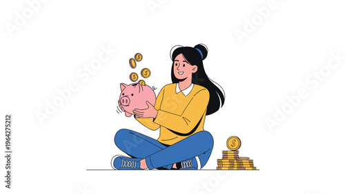 Saving money concept shows a young woman sitting on the floor and happily dropping gold coins into a pink ceramic piggy bank.