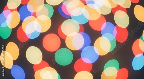 Vibrant glowing bubble shapes floating on gradient backdrop creating playful colorful abstract texture.