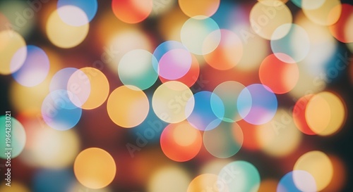 Colorful luminous bokeh lights on soft gradient background producing vibrant creative visual effect.