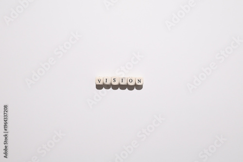 Cuadro en lienzo Vision concept symbolizing leadership, long term strategy, and direction using wooden letter tiles on minimal background