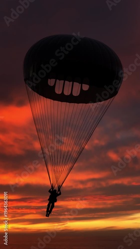 Man flying with parachute high in the sky as silhouette appears against glowing sunrise horizon