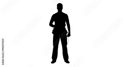 Silhouette of a man standing with a tool belt