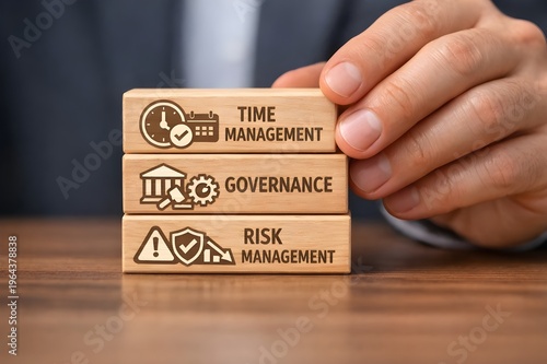 A male professional's  hands placing blocks reflecting corporate governance and risk management on table 