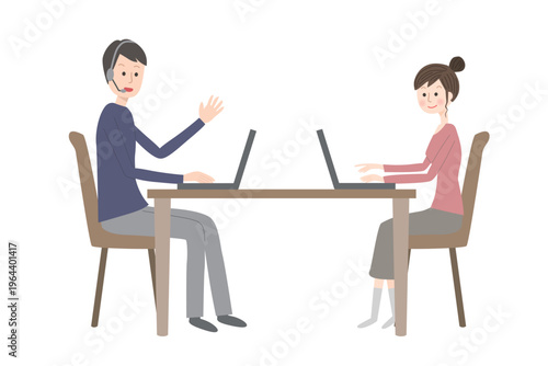 自宅でリモートワークをしている夫婦