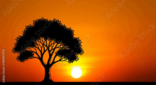 Silhouette of a large tree against a vibrant orange and yellow sunset sky