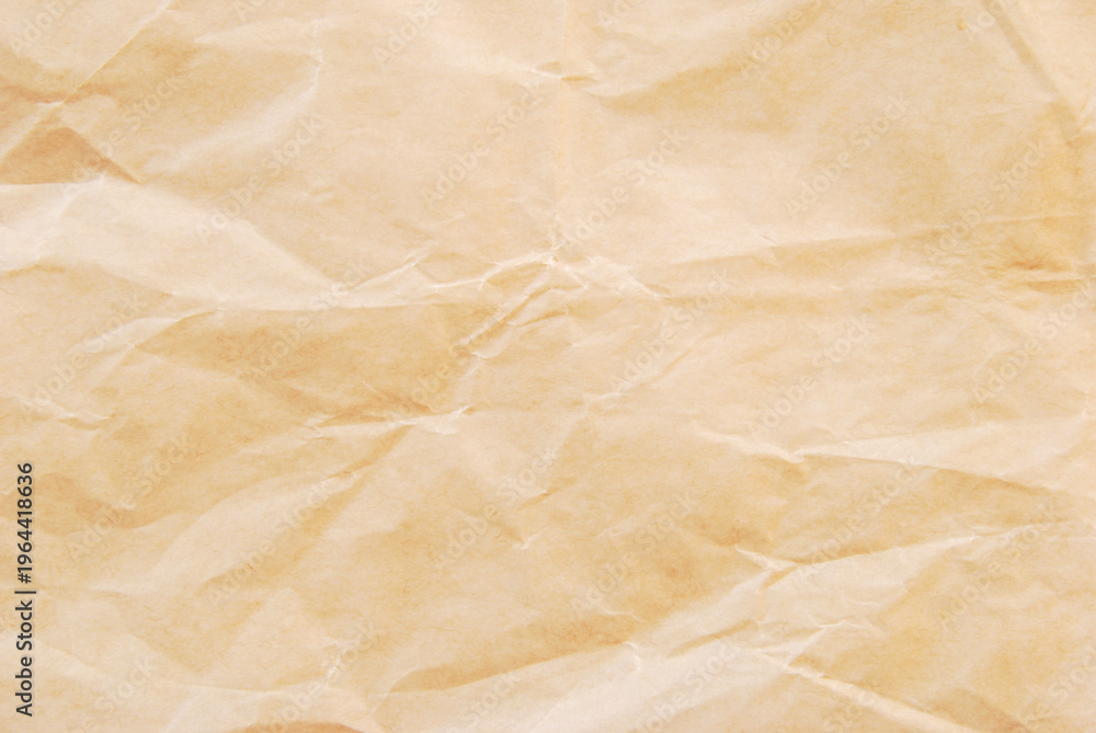 Fototapeta premium Crumpled fine brown kraft paper texture as background