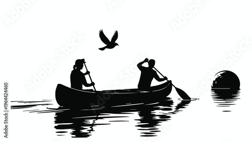 Canoe paddlers at sunrise on lake