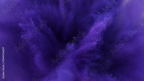 Purple powder explosion forming abstract vibrant pattern concept. Abstract purple powder explosion with vibrant particles and dynamic motion on dark background