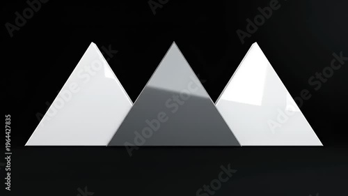 Three white and gray pyramid shapes.