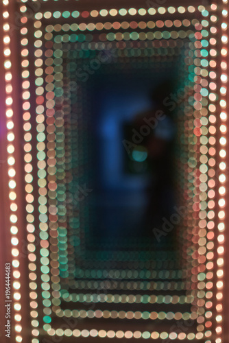 Abstract background of a colorful bokeh light tunnel.