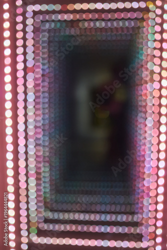 Abstract background of a colorful bokeh light tunnel.