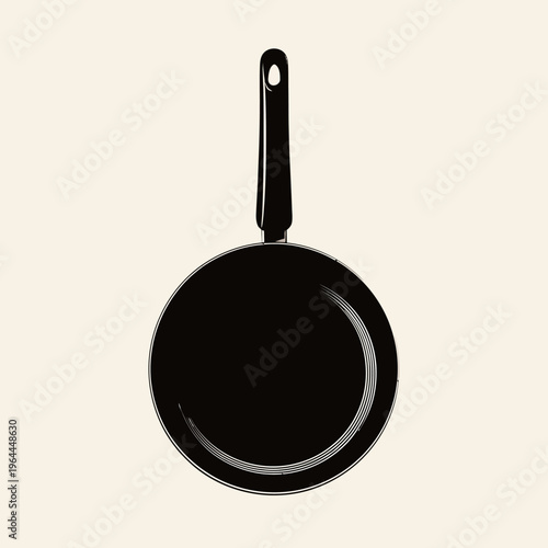 A black frying pan with handle.
