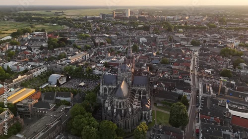 Aerial pullback view of Saint John's Cathedral and Den Bosch at golden hour