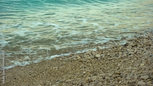 Waves splash on the shore of a tropical beach
