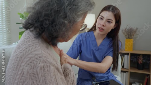 Caregiver elderly nurse home care support healthcare consultation senior compassion in living room, female professional listening to senior woman on sofa, gentle checkup visit builds trust comfort