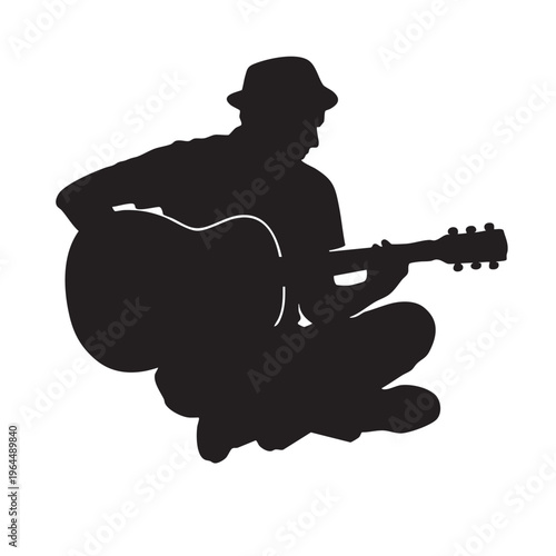 Guitarist silhouette sitting and playing acoustic guitar for folk or unplugged music performance.