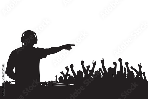 Music artist or DJ silhouette pointing at large crowd audience during live concert or festival.
