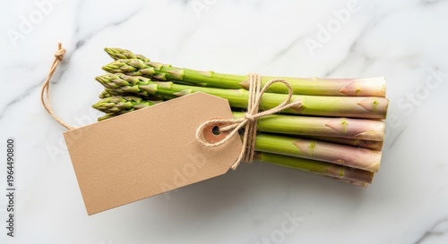 Fresh Asparagus Bundled with Blank Tag on Marble Surface