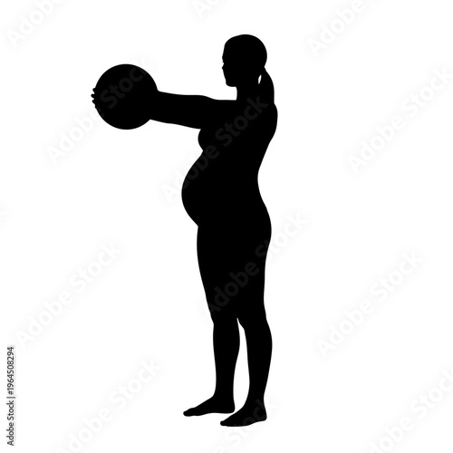 Silhouette of pregnant woman exercising with fitness ball.