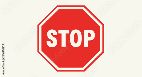 A red octagonal road sign with the word "STOP" in white text