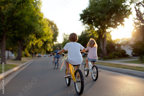 Kids riding bikes in a neighborhood during sunset