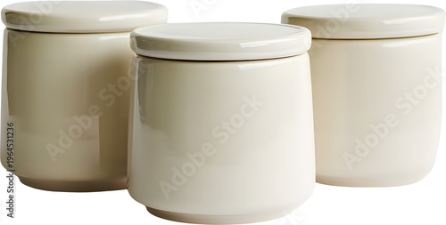 Three matching cream colored ceramic storage jars with lids arranged together for kitchen use isolated on transparent background