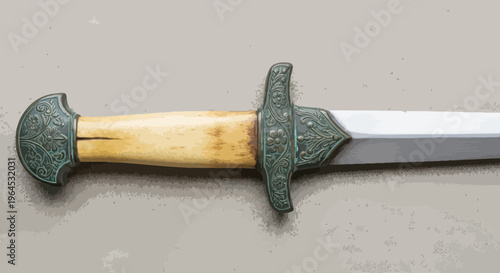 A close-up of a sword with a decorative hilt and a pale wooden handle, resting on a surface