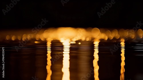 Golden lights reflecting on water