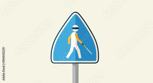 A blue triangular sign with a blind person walking, cane in hand, on a gray pole