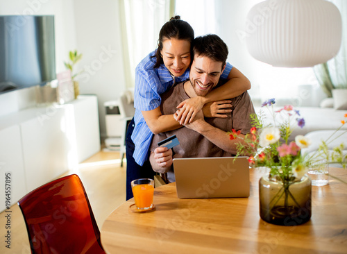 Couple enjoys online shoppi...