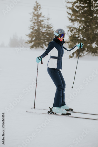 Woman skiing on snowy slope...