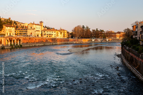 Tableau sur toile Scenic view of the Adige River flowing through Verona, Italy, with historic buil