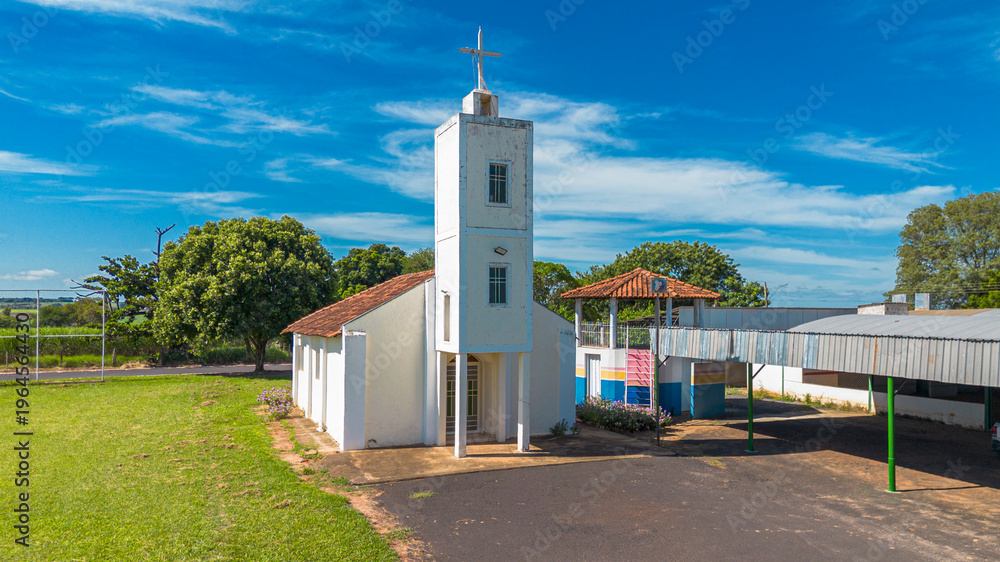 Obraz premium Historic San Sebastian Catholic Church in Monte Belo rural district, Nova Alianca, Sao Paulo, Brazil. Traditional colonial style chapel in small Brazilian town, countryside landmark.