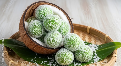 Green coconut balls in a woven basket on a wooden table