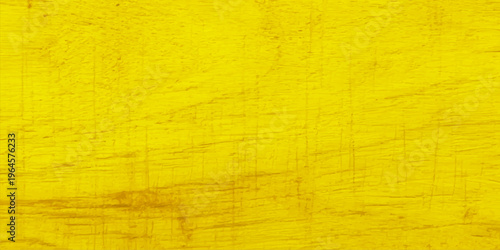 Vivid yellow wood texture with natural grain and distressed aged surface; bright golden timber background for design