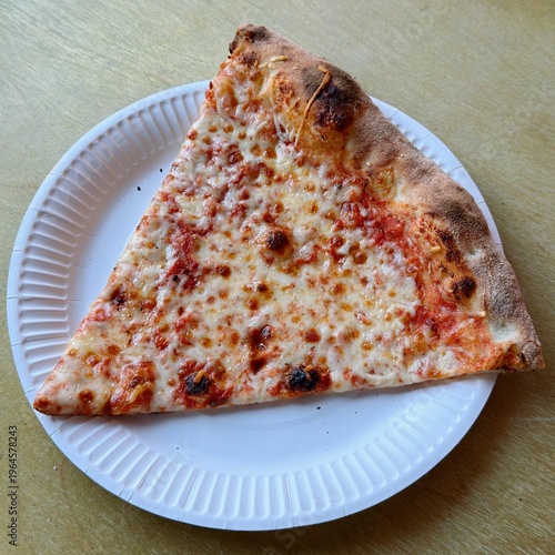 Tablou pe pânză A New York-style pizza margarita slice on a white, round paper take-out plate