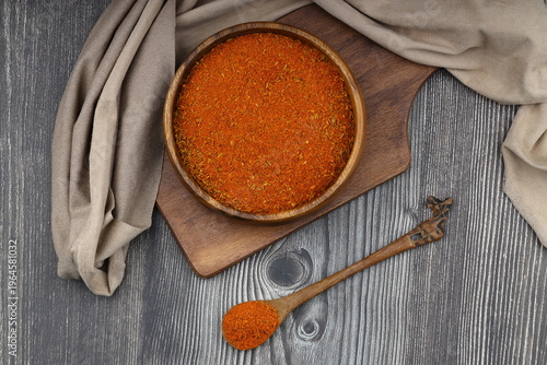Cajun seasoning in a bowl on a dark wooden background