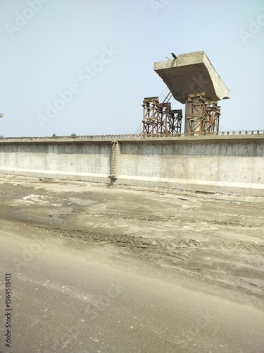 Underconstruction Flyover on a city highway. Over bridge making in progress, civil work and industry background.