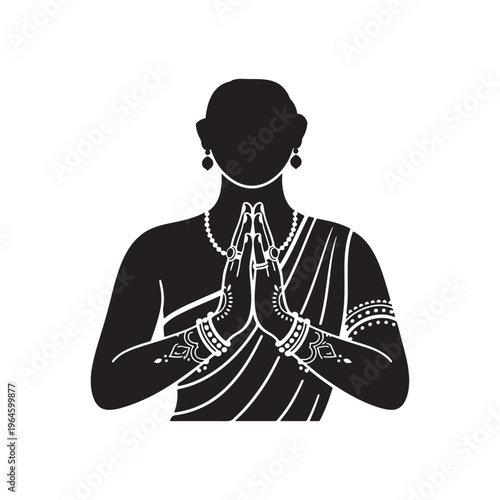 Indian woman in traditional attire with hands clasped in prayer or greeting gesture adorned with bangles and jewelry on a white