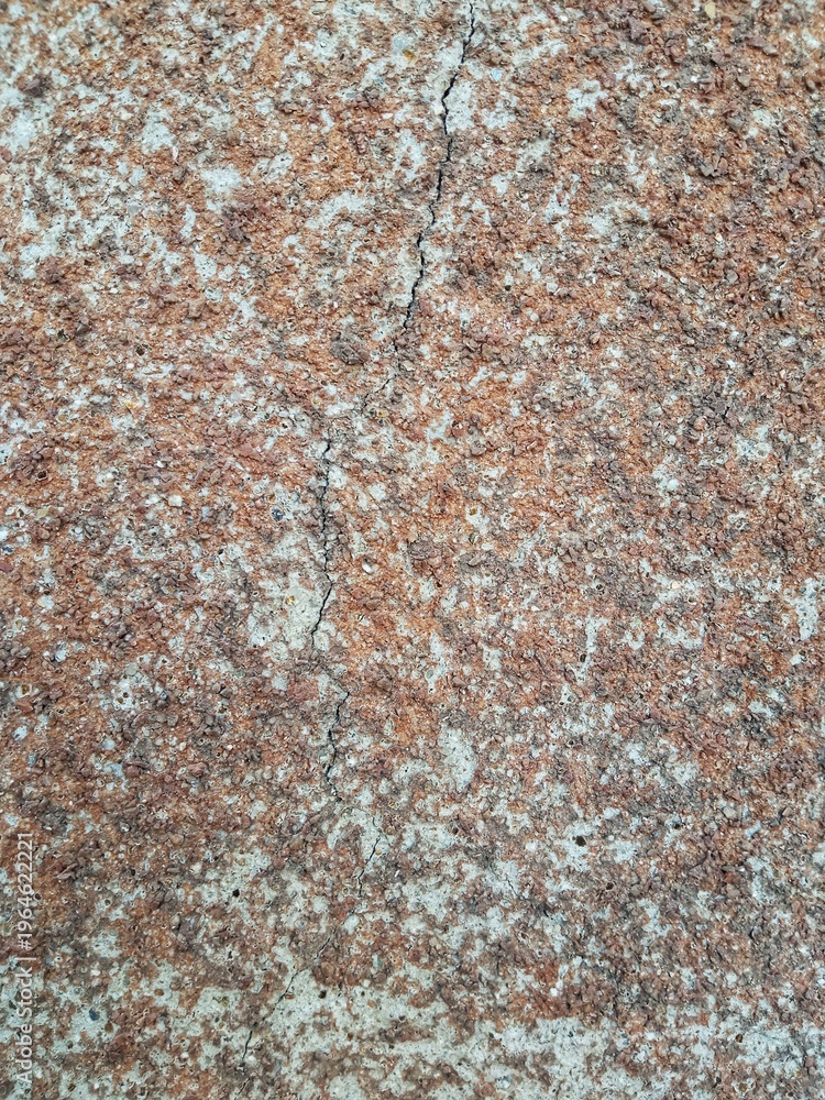 Fototapeta premium Cracked stone texture background with rough weathered surface