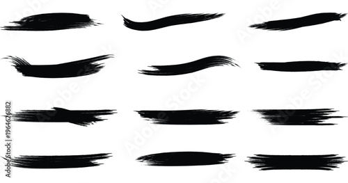 Collection of black brush strokes and smudges on white background