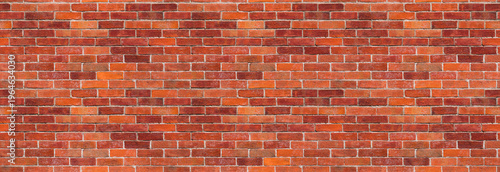 Red brick wall background – brickwall building backdrop with exposed brown stone blocks. The file is a seamless texture, allowing the photo to be tiled.