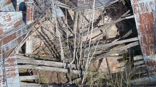 Broken walls and roof in abandoned manor ruins, aerial view